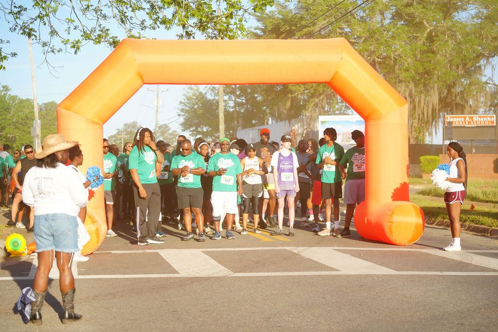 Participants gathered under the start arch